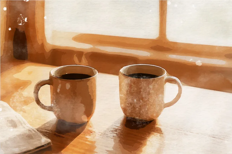 Two coffee cups side by side on wooden table with morning light, symbolizing couple considering their relationship future through discernment counseling in Spokane