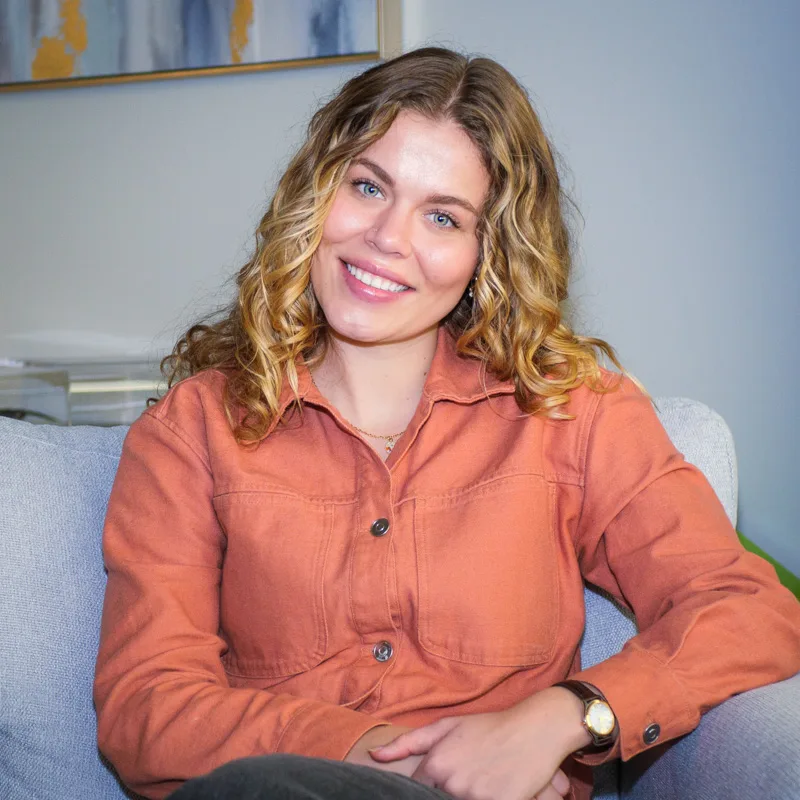 Paige, Marriage and Family Therapy graduate student at Renewed Stories Counseling, smiling warmly while seated in a comfortable therapy office setting, providing individual and couples counseling in Spokane Paige, Marriage and Family Therapy graduate student at Renewed Stories Counseling, smiling warmly while seated in a comfortable therapy office setting, providing individual and couples counseling in Spokane